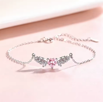 Pink crystal-style heart with silver-tone wing necklace photo 1
