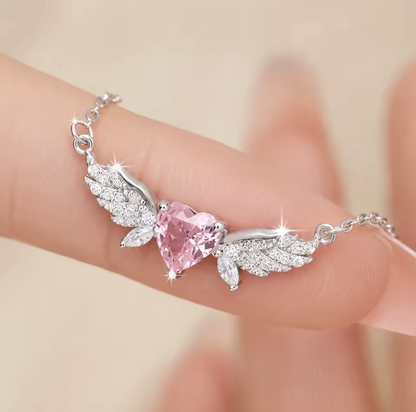 Pink crystal-style heart with silver-tone wing necklace photo 4