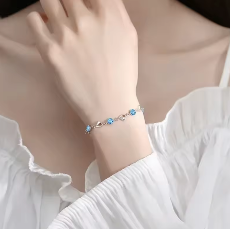 Silver-tone bracelet on wrist