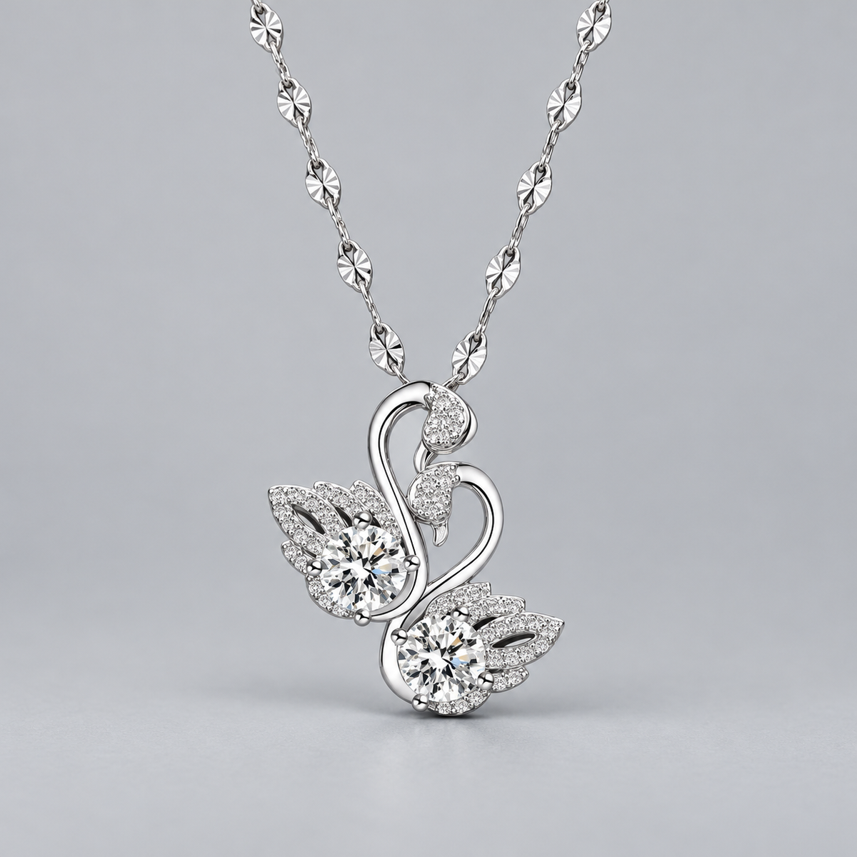 Odette Twin Swan Necklace — front view on soft gray