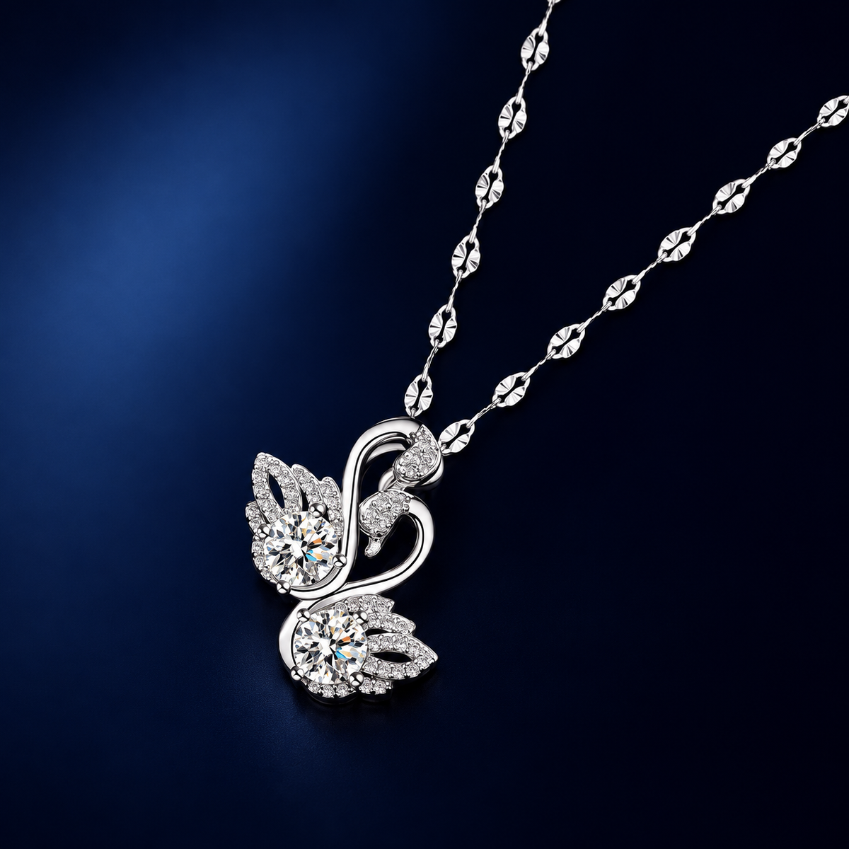 Odette Twin Swan Necklace — angled view on midnight navy