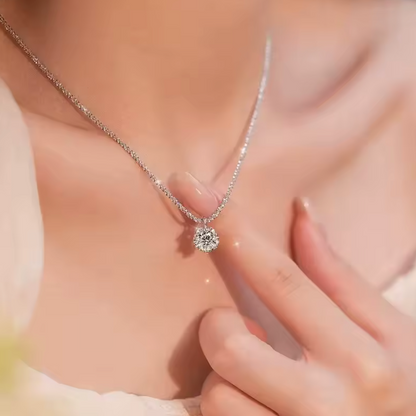Clear-stone pendant necklace close-up on model